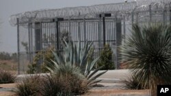 FILE - Photo shows the Adelanto Detention Center in Adelanto, Calif., a desert community northeast of Los Angeles, April 20, 2019. 