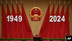 Chinese President Xi Jinping delivers his speech at a dinner marking the 75th anniversary of the founding of the People's Republic of China, at the Great Hall of the People in Beijing, Sept. 30, 2024. 