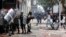 Protesters challenge riot police during clashes in downtown Bogota, Colombia, Aug. 29, 2013.