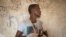 File-Ethnic Tigrayan survivor Abrahaley Minasbo, 22, from Mai-Kadra, Ethiopia, shows his wounds from machetes, inside a shelter, in Hamdeyat Transition Center near the Sudan-Ethiopia border, eastern Sudan, Dec. 15, 2020.