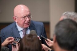 FILE - Russia's U.N. Ambassador Vassily Nebenzia speaks with reporters.