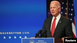 U.S. President-elect Joe Biden speaks to reporters following an online meeting with members of the National Governors Association (NGA) executive committee in Wilmington, Delaware.