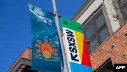 SXSW 2020 banners are seen in the Red River Cultural District on March 6, 2020 in Austin Texas. The South by Southwest festival in Texas has been cancelled due to concerns over the spread of the novel coronavirus.