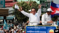 In this June 2, 2017, file photo, opposition party Cambodia National Rescue Party (CNRP) leader Kem Sokha greets his supporters at a rally in Phnom Penh.