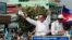 FILE - In this June 2, 2017, file photo, opposition party Cambodia National Rescue Party (CNRP) leader Kem Sokha greets his supporters at a rally in Phnom Penh, Cambodia. 