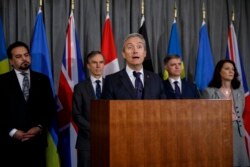 Canadian Foreign Minister Francois-Philippe Champagne addresses the media in London, Jan. 16, 2020.