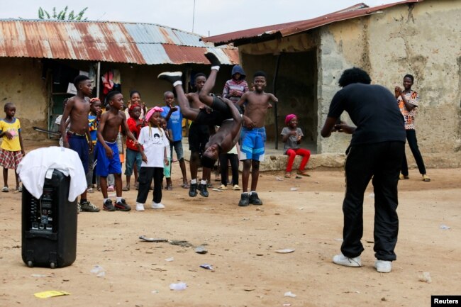 Joshua Anum, who had his left arm amputated 7 years ago, reacts during a rehearsal with other members of "The Incredible Kids" dance group, in Abuja, April 30, 2022. (REUTERS/Afolabi Sotunde)