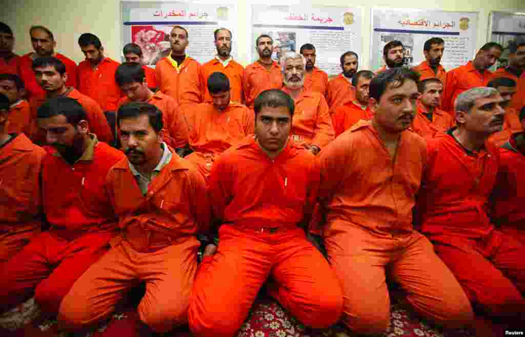 Detainees are displayed for the media during a news conference by Iraq's Interior Minister in Baghdad December 2. Security forces arrested 39 al Qaeda militants, including the group's leadership in Anbar province and one of its top officers in Iraq, in ra