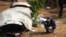 A French investigator takes a photo of the wreckage of a passenger plane at the crash site, in Pokhara, Nepal, Jan.18, 2023. 