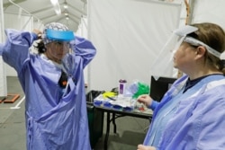 Tilliesa Banks, left, and Amy Leah Potter, right, emergency services nurses at Harborview Medical Center in Seattle, April 2, 2020.