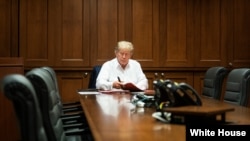 President Donald Trump works in his conference room at Walter Reed National Military Medical Center in Bethesda, Maryland, Oct. 3, 2020, after testing positive for COVID-19. (Official White House Photo by Joyce N. Boghosian)