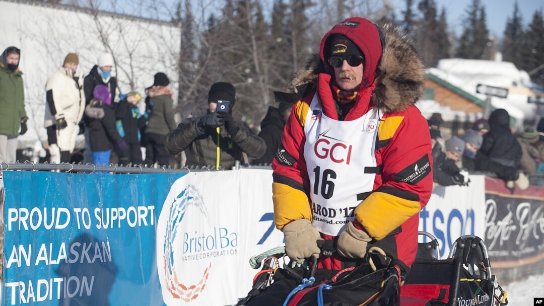 Mitch Seavey takes off two positions ahead of his son, reigning champion Dallas Seavey, at the start of the 45th Iditarod Trail Sled Dog Race in Fairbanks, Alaska, Monday, March 6, 2017.
