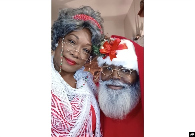 This photo shows Eric Elliott and his wife, Moeisha Elliott, at home in Killeen, Texas, on Oct. 29, 2022. The Elliotts have invested in months of professional training to play Santa and Mrs. Claus but said some prospective clients aren’t looking for Black performers. (Eric Rex Elliott via AP)