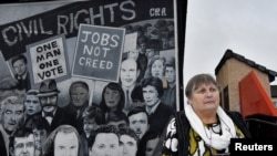 FILE - Jean Hegarty, whose brother Kevin McElhinny was shot dead by paratroopers during the events of "Bloody Sunday", poses for a photograph ahead of the 50th anniversary of the 1972 "Bloody Sunday" shootings in Londonderry, Northern Ireland, Jan. 27, 20