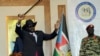 South Sudan President Salva Kiir waves to the delegates attending South Sudan Peace talks in Juba, South Sudan, Sept.9, 2019. Machar returned to meet with President Salva Kiir and held talks in preparation for the formation of a coalition government.