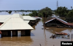 FILE - Houses partially submerged in flood waters are pictured in Lokoja city, Kogi State, Nigeria, Sept. 17, 2018.