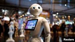 A 'Pepper' humanoid robot, manufactured by SoftBank Group Corp