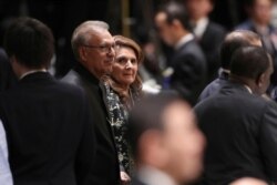 Pakistani President Arif Alvi and his wife Samina Alvi attend a banquet hosted by Japan's Prime Minister Shinzo Abe in Tokyo, Oct. 23, 2019.