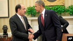 Presiden AS Barack Obama (kanan) menegaskan kepada PM Irak Nouri al-Maliki bahwa AS akan membantu Irak menghadapi al-Qaida dalam pertemuan di Gedung Putih (1/11). 