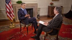 President Obama with VOA's Andre de Nesnera in the Map Room of the White House