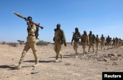 FILE - Puntland security forces walk in formation in Balidhidin village, Puntland region, Somalia, on Jan. 26, 2025.