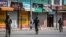 Indian paramilitary soldiers patrol a deserted market area in Srinagar, Indian controlled Kashmir, Sept. 2, 2021 as Indian authorities cracked down on public movement after the death of Syed Ali Geelani, a top separatist leader.
