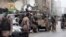 Security personnel surround the Stock Exchange Building after it was attacked by gunmen, in Karachi, Pakistan, June 29, 2020.