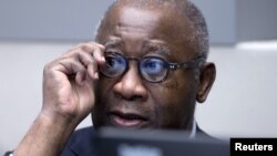 Former Ivory Coast President Laurent Gbagbo awaits the start of his trial at the International Criminal Court in The Hague, Netherlands, Jan. 28, 2016. The International Criminal Court's prosecutor vowed on Wednesday to "leave no stone unturned" in investigating alleged crimes committed by all sides in Ivory Coast's brief 2010 civil war, including by supporters of President Alassane Ouattara. 