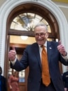 Senate Majority Leader Chuck Schumer celebrates as the Senate begins voting on the government funding bill just in time to meet the midnight deadline, at the Capitol in Washington, Dec. 20, 2024.