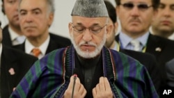 Afghan President Hamid Karzai delivers a speech (July 8 2012 file photo)
