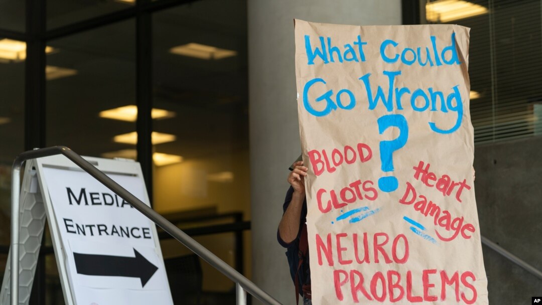 An anti-vaccine protester demonstrates outside the Los Angeles Unified School District administrative offices in Los Angeles Thursday, Sept. 9, 2021. The Los Angeles board of education is expected to vote Thursday on whether to require students 12…