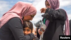 Funérailles de quatre membres de la famille Afzaal tués dans une attaque à la voiture-bélier, London, Ontario, Canada, 12 juin 2021.