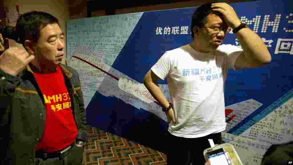 Steve Wang a representative from the committee for relatives of Chinese passengers onboard Flight MH370 talks to journalists after a closed door meeting with Malaysian officials via teleconference in Beijing, April 2, 2014.