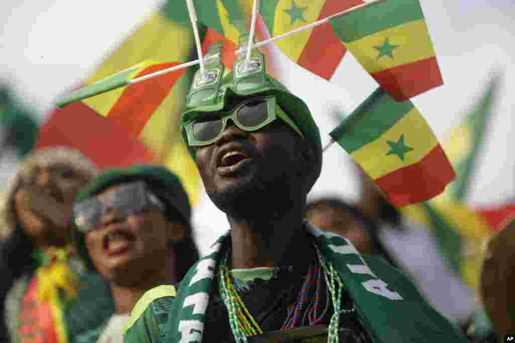 Senegal&#39;s supporters chant before the soccer match between Malawi and Senegal; Cameroon, Jan. 18, 2022.