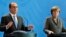 German Chancellor Angela Merkel and French President Francois Hollande talk to reporters after meeting in Berlin, March 31, 2015.