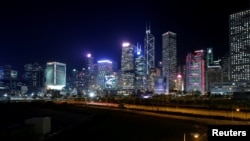 FILE - An evening view of the financial Central district in Hong Kong, China, Nov. 23, 2017. 