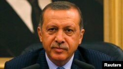 FILE - Turkey's Prime Minister Tayyip Erdogan addresses the media in Ankara, Aug. 15, 2013. 