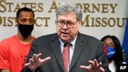 Attorney General William Barr talks to the media during a news conference about Operation Legend, a federal task force formed to fight violent crime in several cities, in Kansas City, Mo., Aug. 19, 2020. 