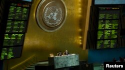 Two electronic boards show the results of a vote about supporting the opposition forces in Syria, in the United Nations General Assembly in New York, May 15, 2013.