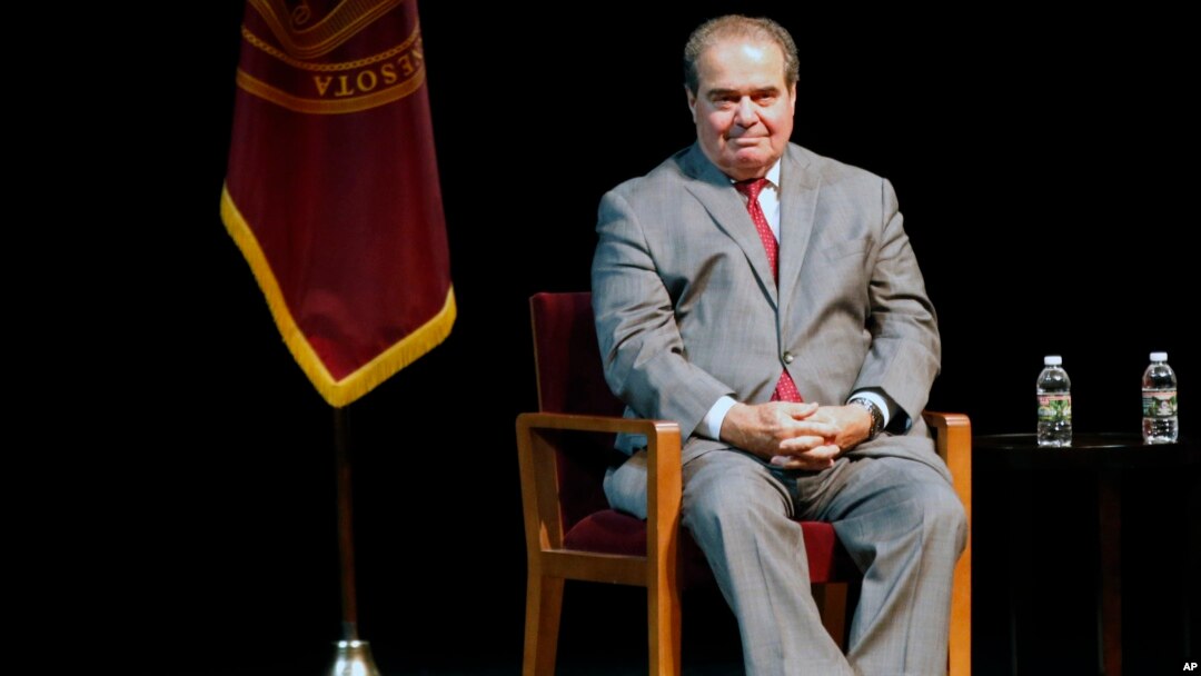 FILE - In this Oct. 20, 2015, photo, US Supreme Court Justice Antonin Scalia waits during an introduction before speaking at the University of Minnesota.
