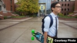 FILE - A student walks across campus at the University of Oregon in Eugene, Oregon.