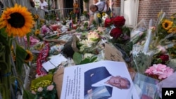 Picture and flowers mark the spot where journalist Peter R. de Vries was shot in Amsterdam, Netherlands, July 8, 2021. Peter R. de Vries, who is widely lauded for fearless reporting on the Dutch underworld, was shot on July 6, 2021.