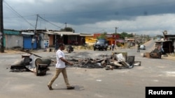 The barricaded streets of Libreville, Gabon, have nearly emptied following two days of deadly protest over presidential election results. Soldiers were deployed Friday. 