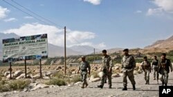 FILE - Afghan border police walk in Ishkashim, Badakhshan province, northeastern Afghanistan, Aug. 16, 2016. Afghan border forces have reportedly reclaimed Arghanj Khwa district in the province from the Taliban.