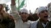 FILE - Activists of the Islamic alliance Muttahida Majlis-e-Amal chant anti-government slogans during a protest against emergency rule in Islamabad, Nov. 16, 2007. There was a split in MMA because of differences among different political parties, and it collapsed in 2008. But in December 2017, the religious heads of five Islamist parties announced the revival of MMA to contest the 2018 general elections.