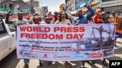 FILE - Journalists and activists march during World Press Freedom Day, May 3, 2018, in Nakuru, Kenya. 