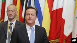 British Prime Minister David Cameron leaves an EU summit in Brussels on December 9, 2011.