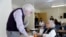 In this April 13, 2018 photo, Patrick Arbore, left, talks to Corazon Leano as he conducts an anti-bullying class at the On Lok 30th Street Senior Center in San Francisco. 