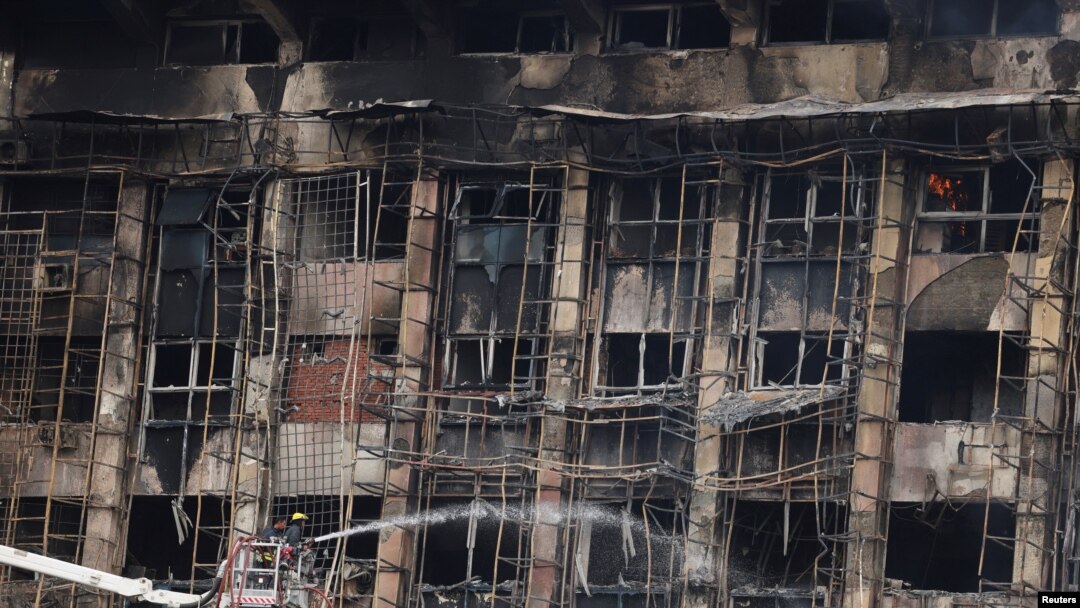 Efforts are made to douse a fire that broke out at a police facility, in Ismailia, Egypt, October 2, 2023.