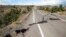 FILE - This photo provided by the National Park Service shows earthquake damage to Crater Rim Drive inside Hawaii Volcanoes National Park in Hawaii, Aug. 17, 2018. 